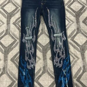 Mackeen distressed denim jeans .